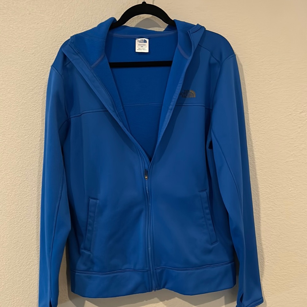 Men’s The North Face hooded lightweight jacket, size medium, color blue.